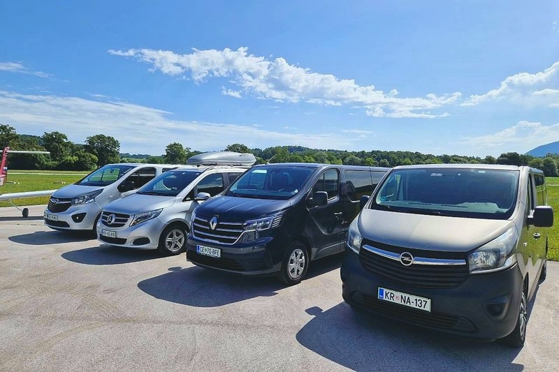 Four TourSlo minibuses in a row at an angle, the Opel Vivaro nearest