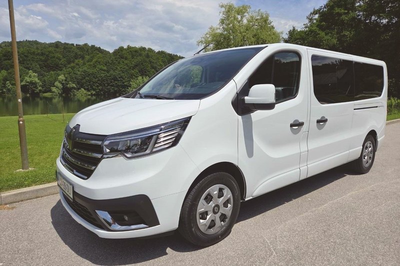 New white Renault Trafic of TourSlo by a lake